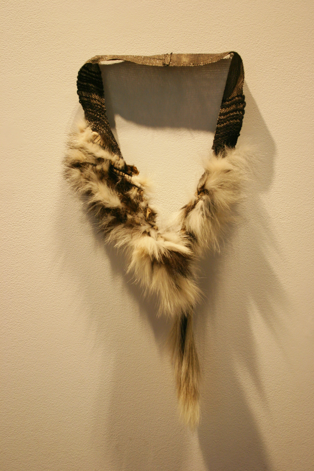 John Brooks. Neck Piece. skunk, cotton, linen, metallic thread. 2012. Courtesy of the artist.